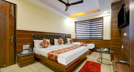 Hotel Le grand Roof Top restaurant -Walk -in  from Rk Ashram  metro Station Room Type - Luxury Triple Suite Room with Smart TV