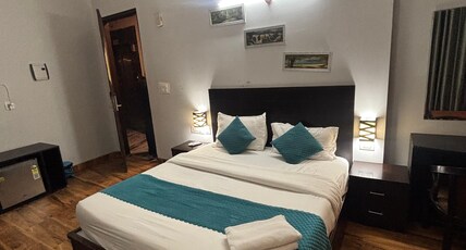 Garnet suites and resorts  Room Type - Deluxe Room