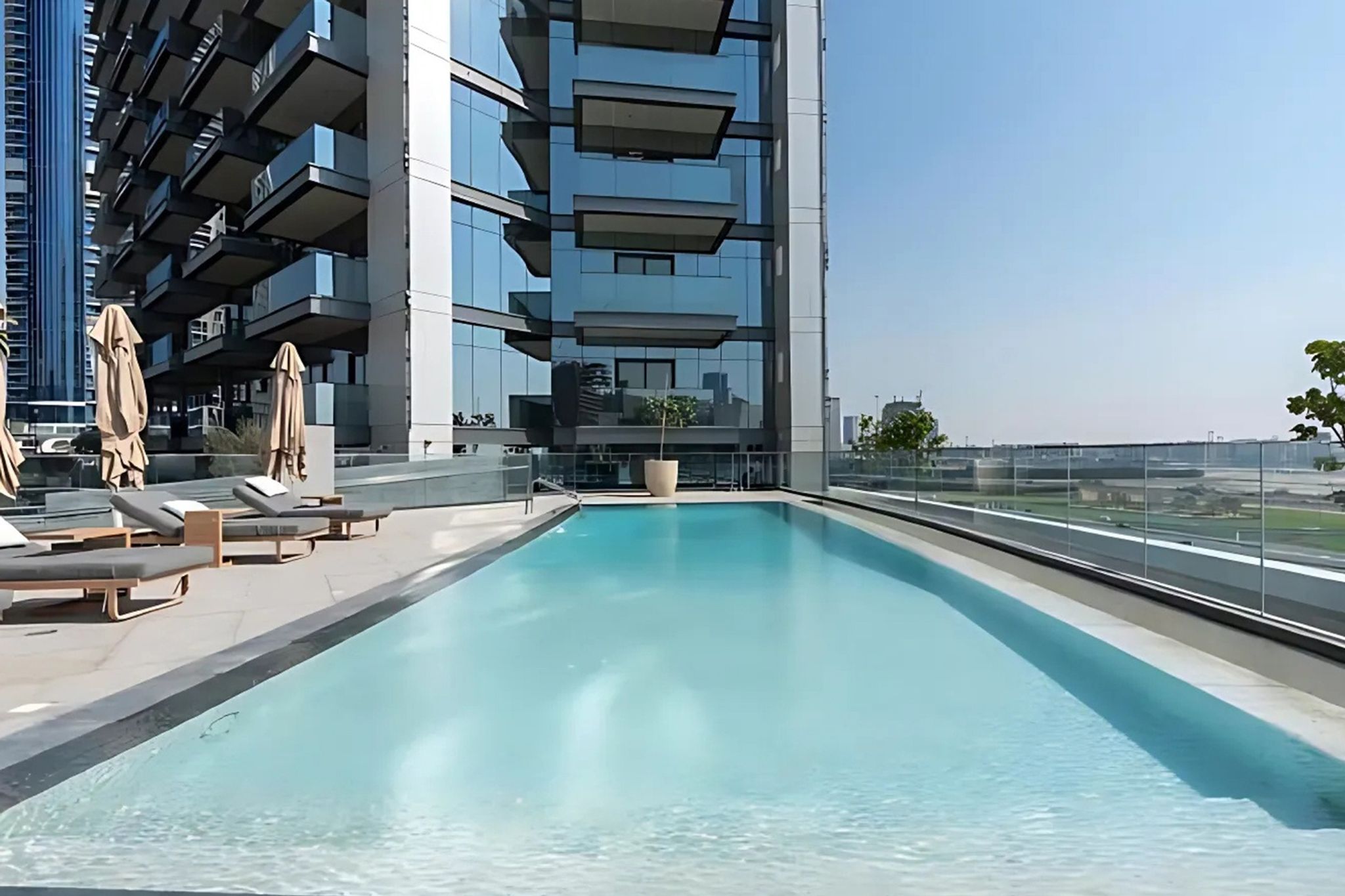 ELIVAAS Curated High-Floor 1BR with Burj Khalifa View - Tap to explore photos