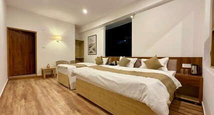 KEDARKHAND HOTEL Room Type - Triple Deluxe Bedroom with forest view
