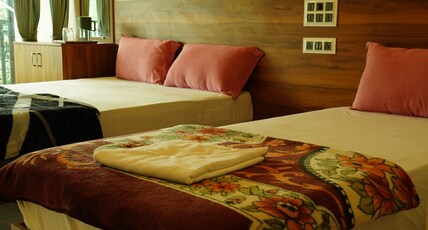 Vasu Inn| Rooms & Caretaker Room Type - Premium Triple with Balcony