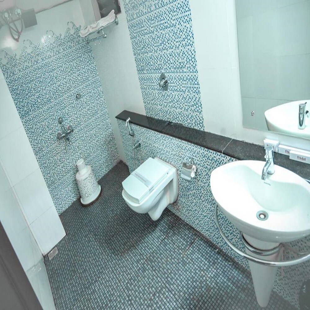 Redbell Suites Manjeri - Tap to explore photos
