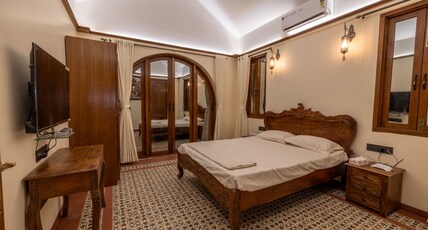 Ishaan Abode Room Type - DELUXE ROOM WITH BALCONY AND POOL VIEW ROOM NO 3
