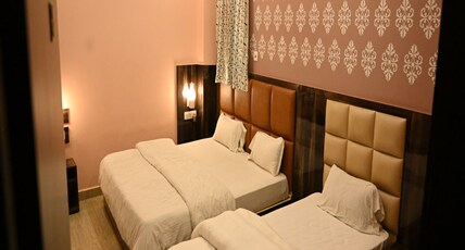 HOTEL NEEL GAGAN  HOTEL TOURIST Room Type - LUXURY TRIPLE BED AC ROOM