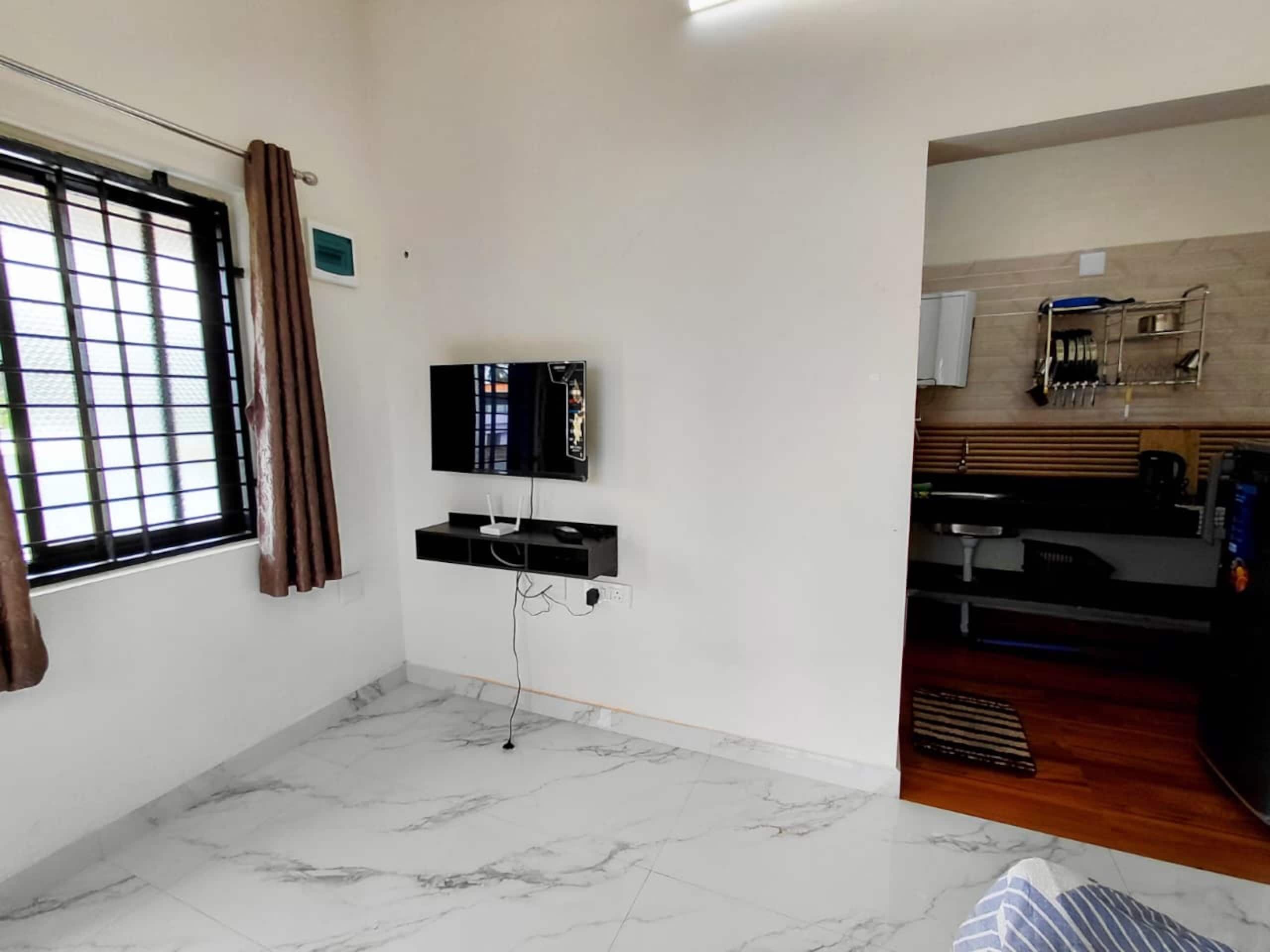 AGM Budget Non-AC Studio suite with Kitchen and Bath - Tap to explore photos