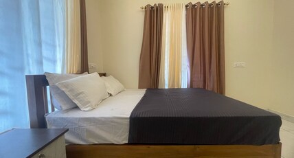 Peak Stay Varkala Room Type - Deluxe Double Room 1