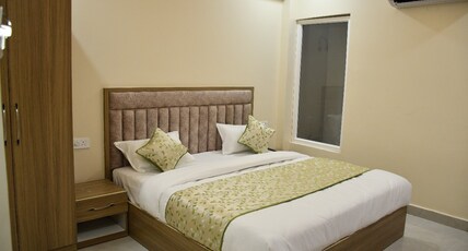 Yash Hotel Room Type - Deluxe City View King Bed Room