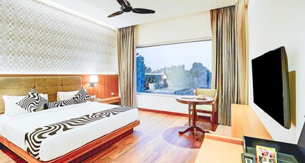 Sunday Resort & Spa Manesar by CheckIn, Gurugram Room Type - Premium Pool View King Bed Room with Balcony