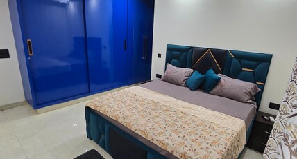 Jasmine Stays | Premium 2 BHK Escape | SEC 57 Room Type - Bedroom 1