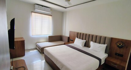 Guru Kripa Hotel Room Type - Deluxe Room with Sofa Bed
