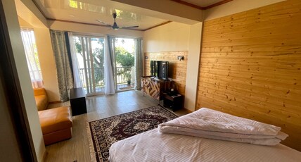 Titos homestays Room Type - Super Deluxe Room with Lounge