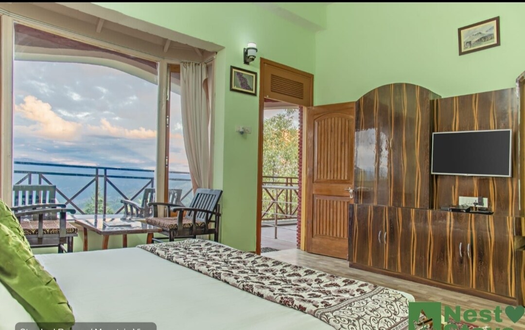Kausani Best Inn - Tap to explore photos