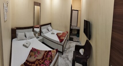 Tiwary Guest House Room Type - Four Bedded AC Room