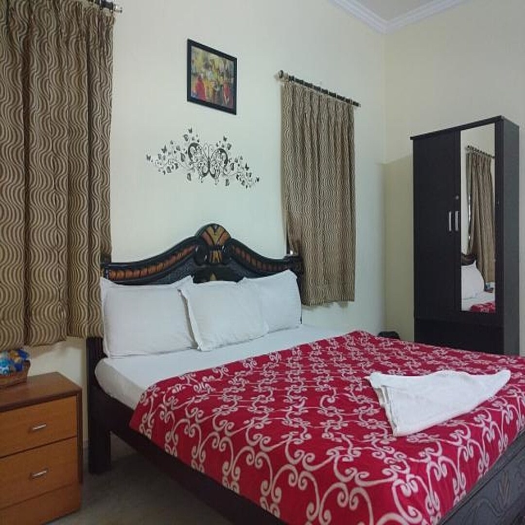 R Grand Comfort Stays Hotel - Tap to explore photos