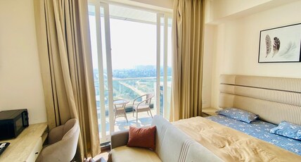Quite Luxe SatyaStudio Dwarka Expressway Airport Room Type - Bedroom 1