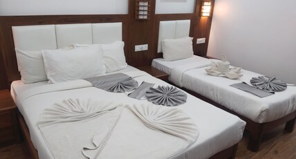 Hotel White House Munnar | Luxury Resort Room Type - Royal Triple Bedded Family Room with Balcony Hotel White House Munnar | Luxury Resort Room Type - Royal Triple Bedded Family Room with Balcony