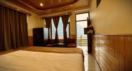 Wander Thrives iNN by ADS (A unit of White Petals) Room Type - Comfort Haven (Deluxe Room With Balcony and Separate designated washroom)