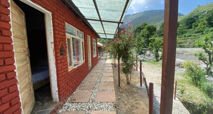 Tiger Fall Aquatic Camps | Swiss Tents Room Type - Luxury River Side Cottage