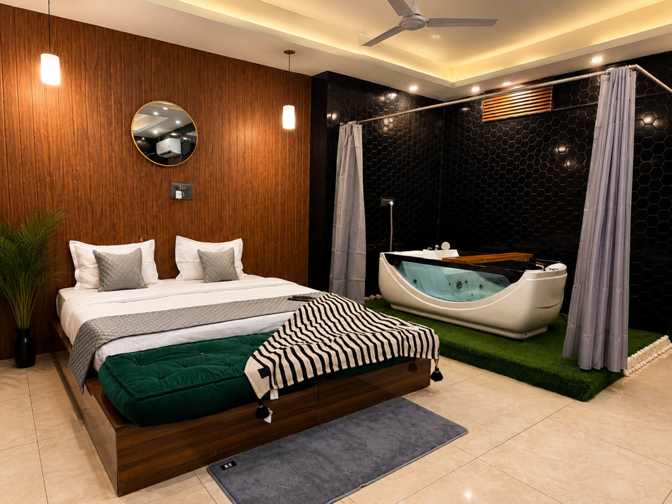 Cozy stay with Jacuzzi Home Theatre Sushant Lok - Tap to explore photos