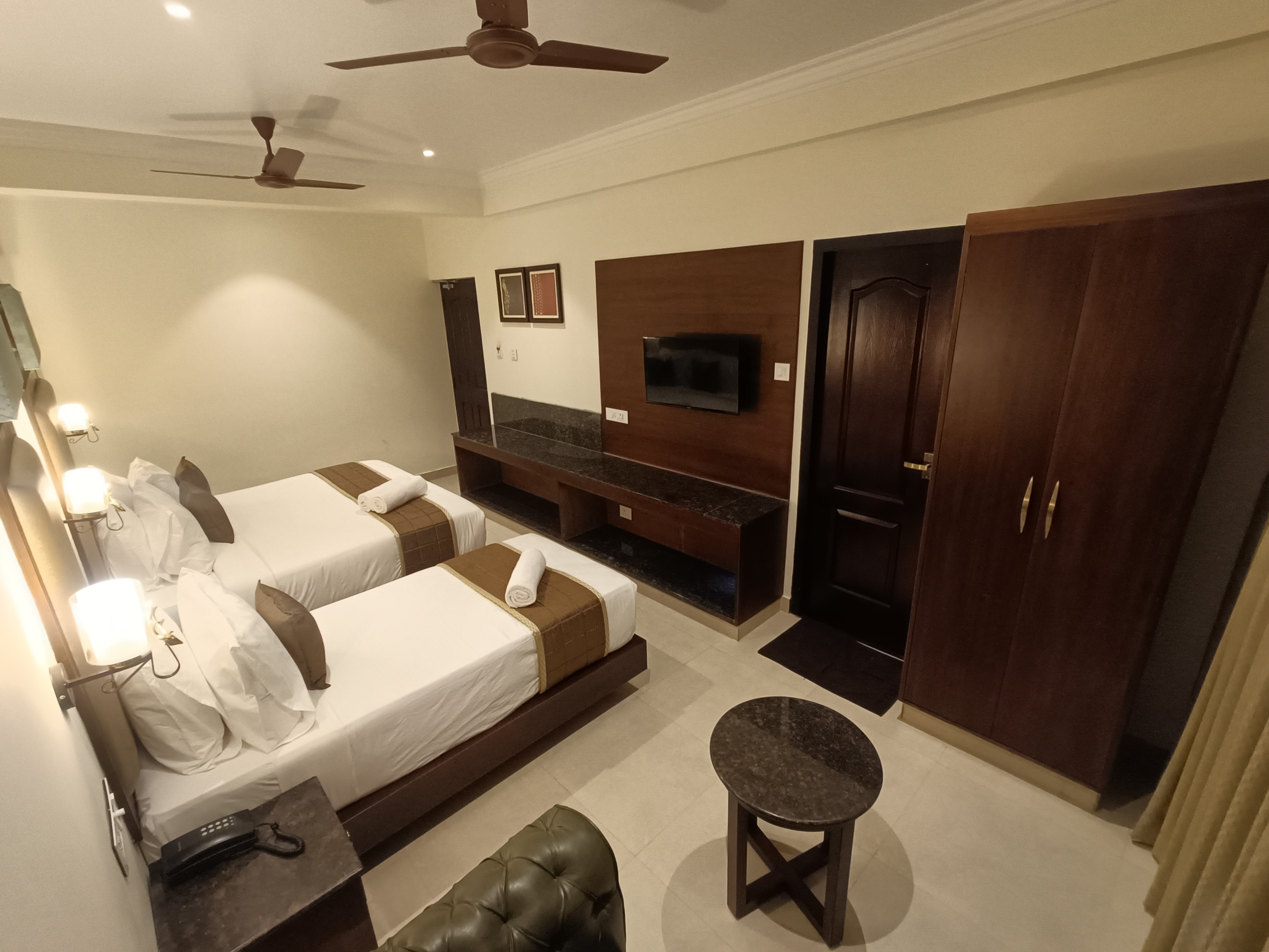 Hotel Comorin Grand - Tap to explore photos