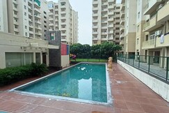 E Globe Spacious 2BHK City Retreat in Agra Society Pool Near Taj Mahal By Homeyhuts