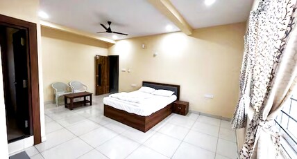 Royal Comforts Budigere Room Type - Deluxe Double or Twin Room