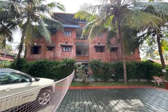 Malgudi Holidays Apartment | Rooms & Kitchen