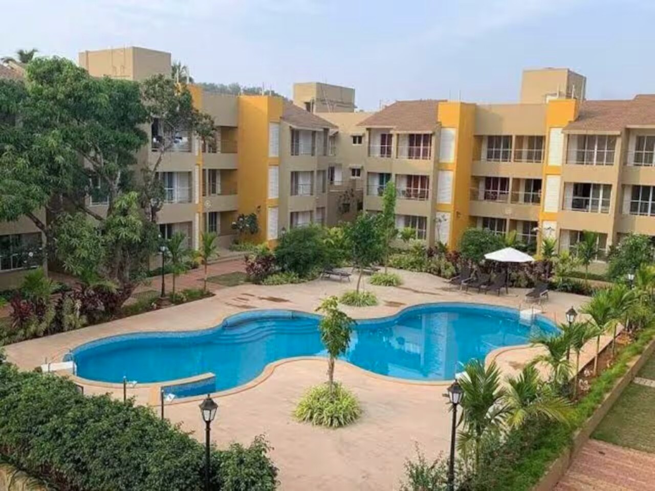Bellini By KiwiStays | 2 BHK | Pool - Tap to explore photos
