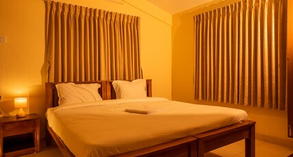 JUSTAY HOMES Room Type - Deluxe Room ( Mullai )