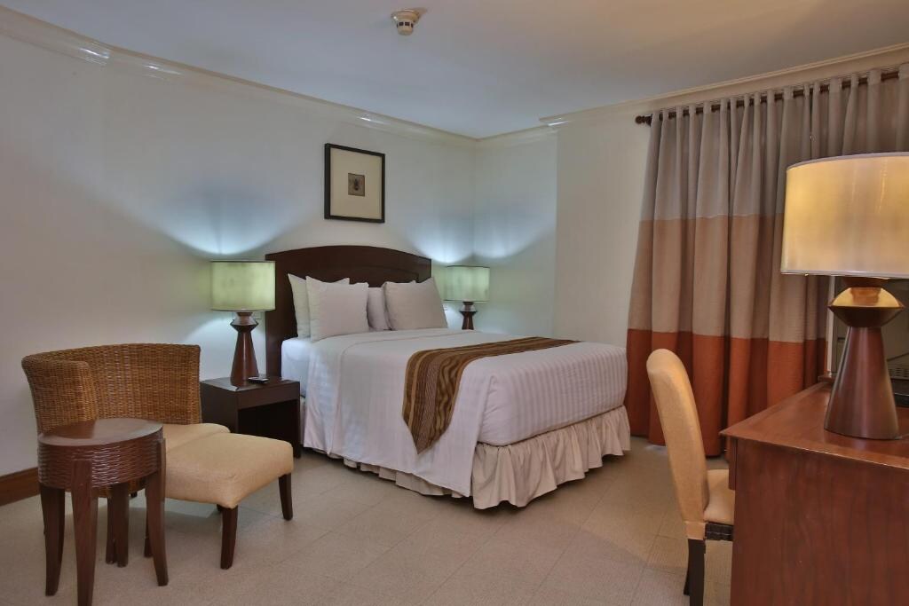 Crown Regency Suites Mactan - Tap to explore photos
