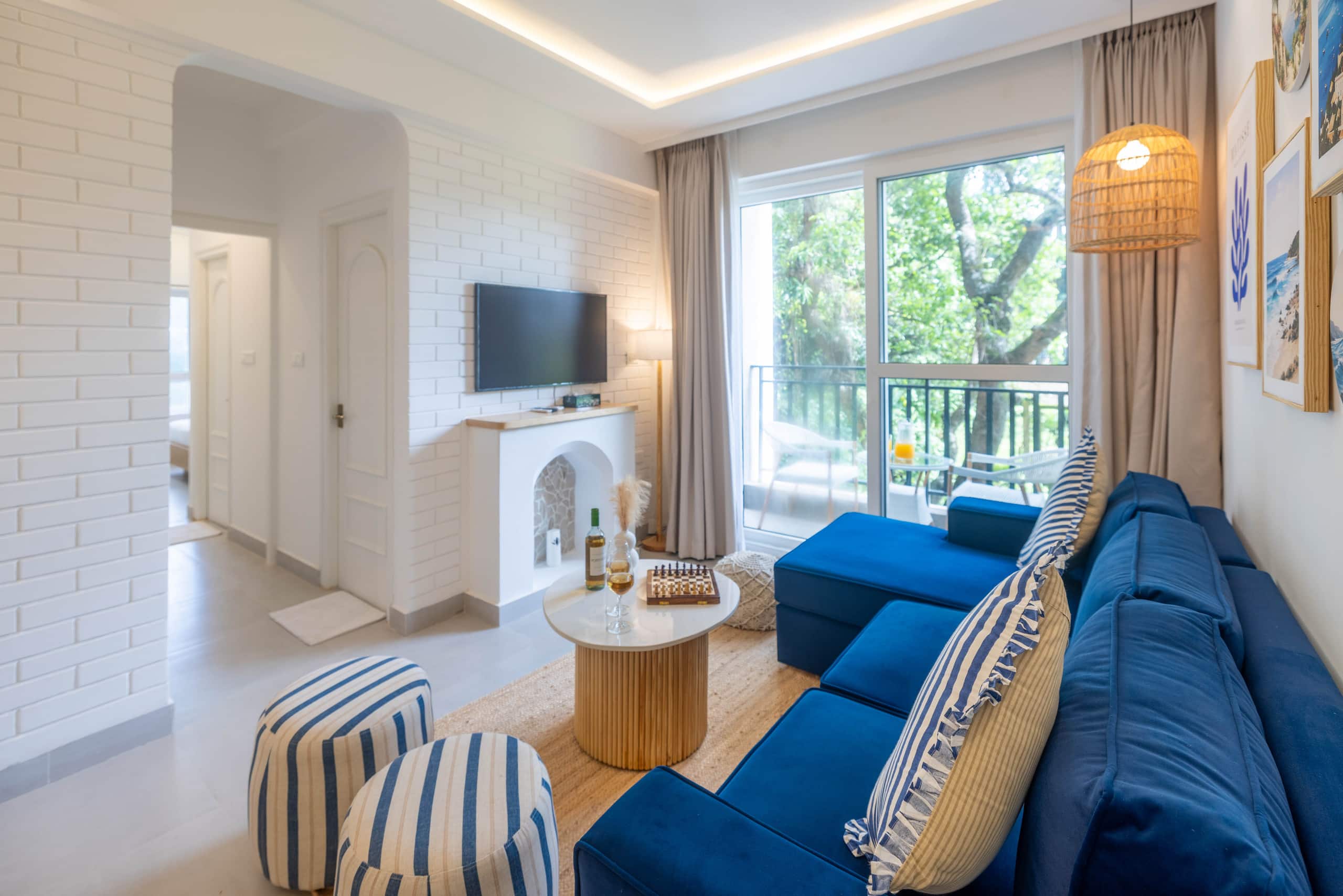 Cozy 2BR Candolim Escape | Pool, Gym & Hill Views | Hireavilla - Tap to explore photos