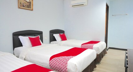 Hotel O Utama Inn Room Type - Suite Triple