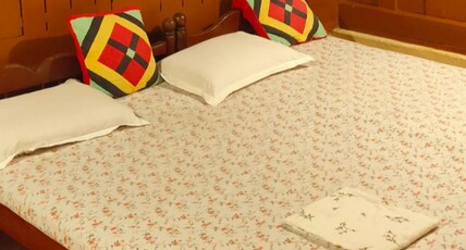 Kuttickattil Gardens Homestay Room Type - WOODEN DOUBLE ROOM WITH AC