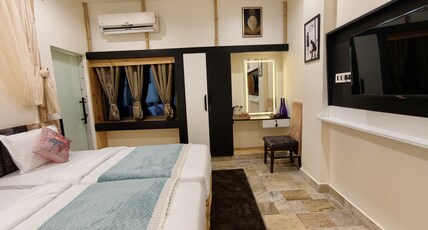 STAYGURU USHA RESIDENCY Room Type - Super Deluxe Triple Bed