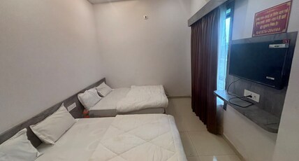 Pujari Guest House. Room Type - Family Room ( 2 Double Bed | 4 Pax )