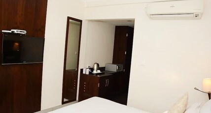Antarman Stays l Riverside Room Type - Deluxe Room