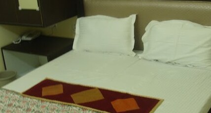 ABHINANDAN Room Type - Deluxe Rooms