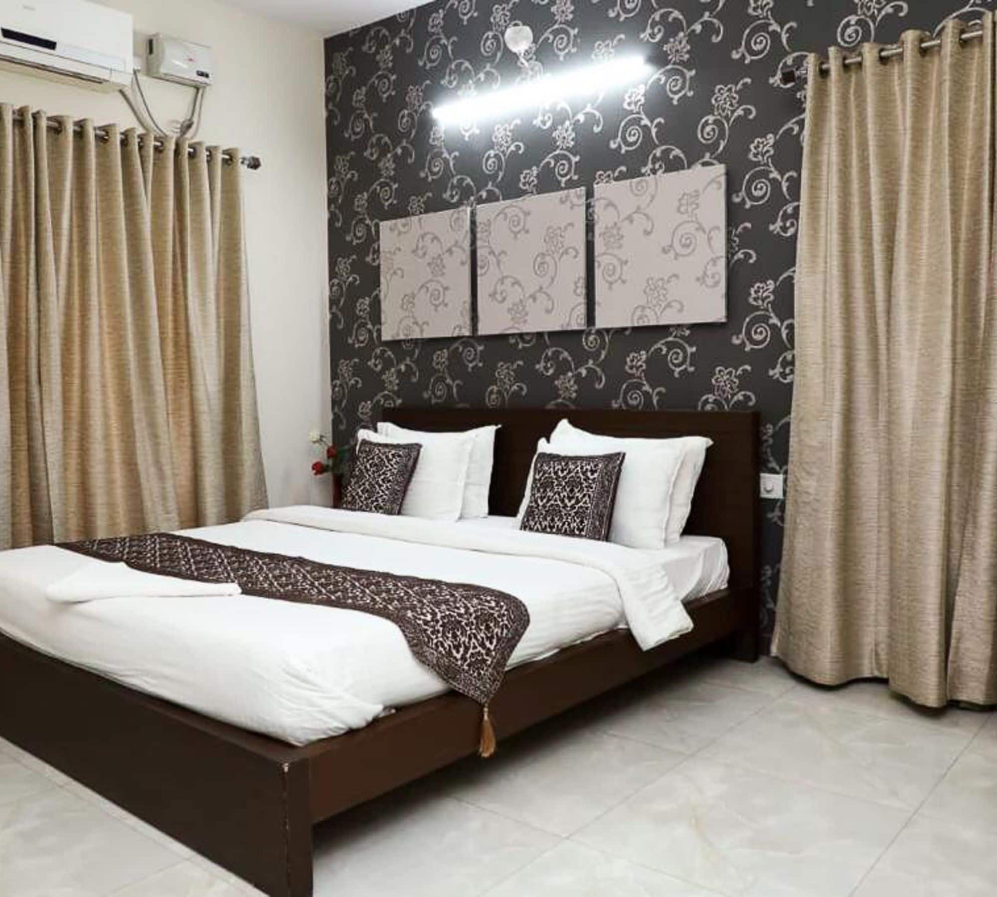 Pink Petals service Apartment by WB Hotels - Tap to explore photos