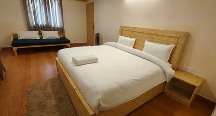 The Auli Meadows Room Type - Executive room (Quad sharing) with Mountain View ( Heated Bedding )