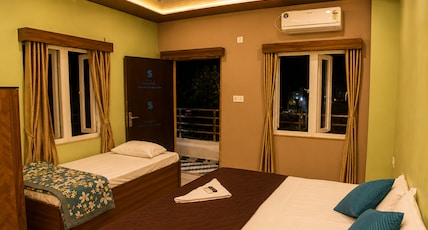 Shri Shiva Homestay Room Type - Triple Room with Garden View Shri Shiva Homestay Room Type - Triple Room with Garden View