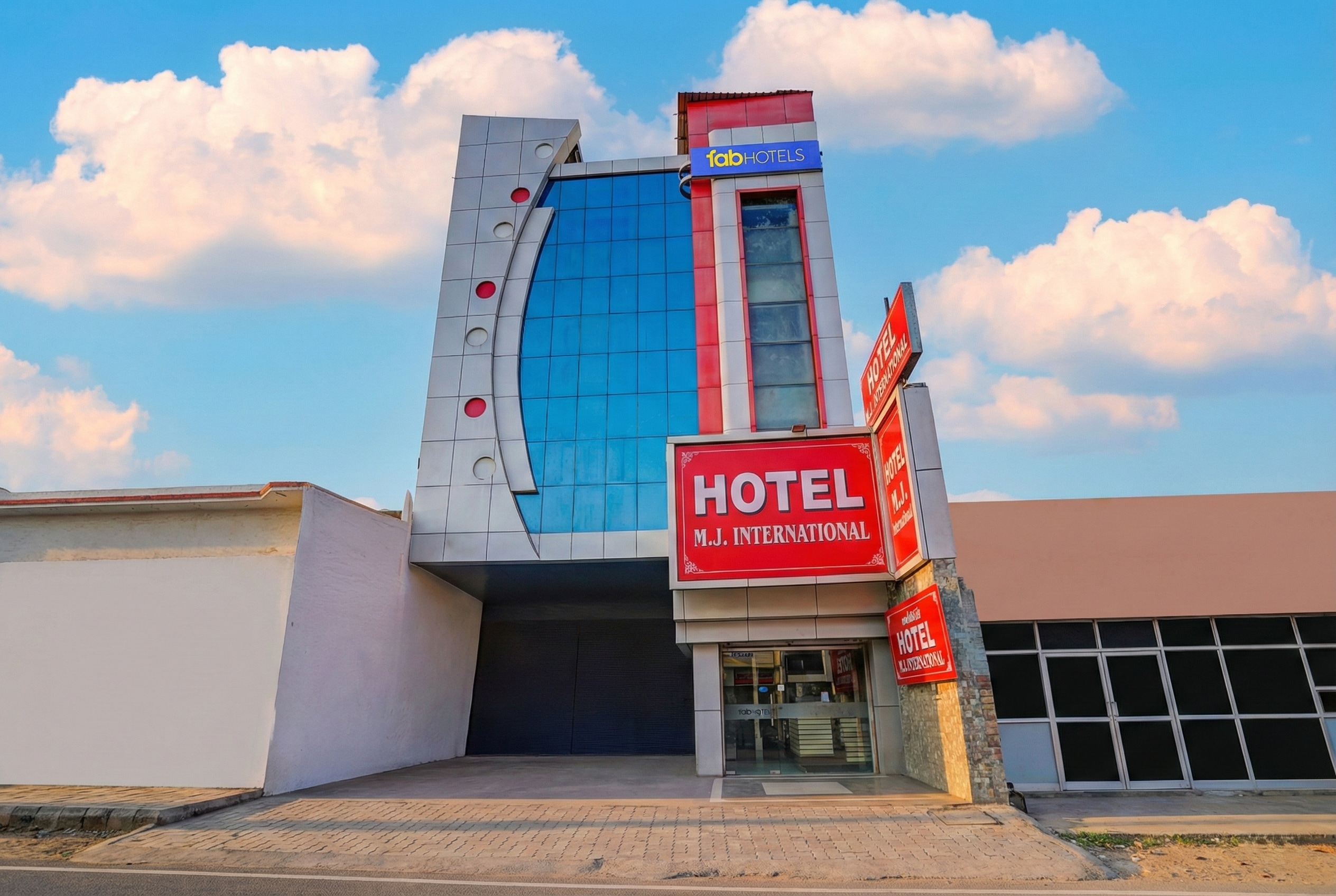 FabHotel MJ International - Tap to explore photos