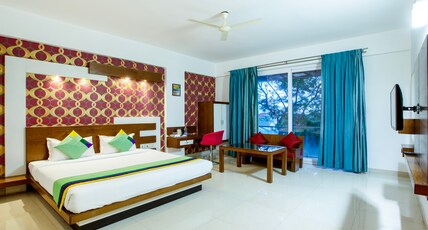 Treebo New Plus Point Room Type - Deluxe Room