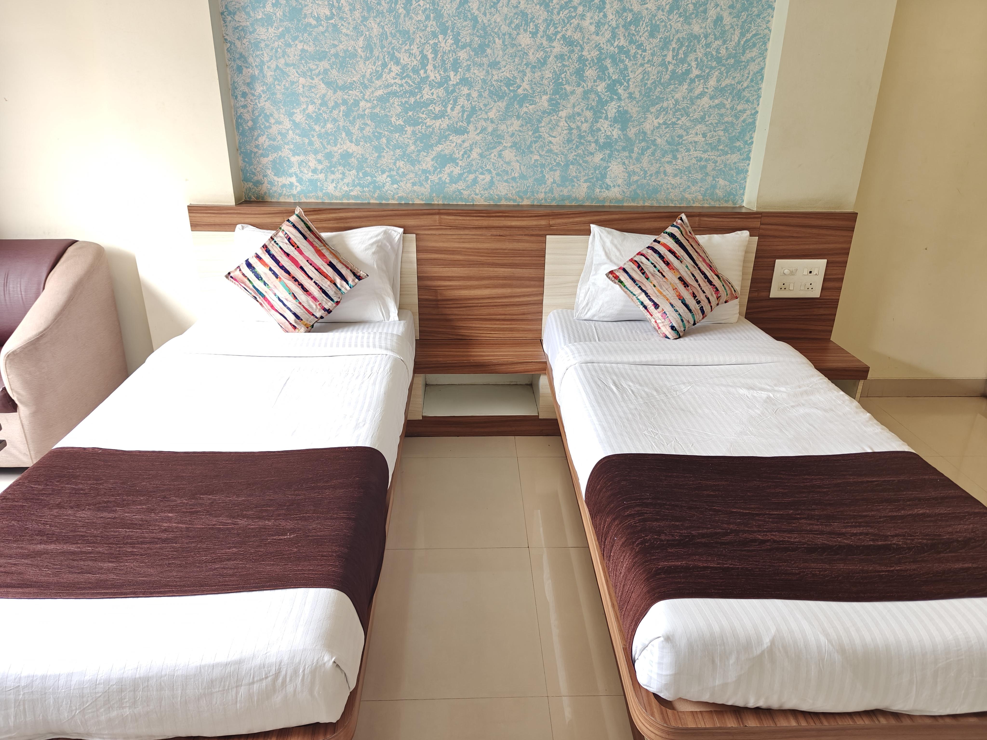Hotel Amruta Garden - Tap to explore photos
