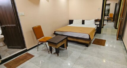 HOTEL OM GRAND AND OM CONVENTION Room Type - DELUXE AC ROOM