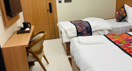 The Mewar By vasundhara Hotels A unit of Tip Top Room Type - Standard Room with one double and one single bed The Mewar By vasundhara Hotels A unit of Tip Top Room Type - Standard Room with one double and one single bed