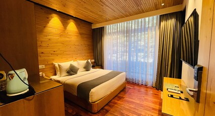 Moksha Riverside Room Type - Standard room ( Balcony and Hill view ) Moksha Riverside Room Type - Standard room ( Balcony and Hill view )