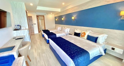 Kaani Palm Beach Room Type - Deluxe Quadruple room Seaview with Balcony Kaani Palm Beach Room Type - Deluxe Quadruple room Seaview with Balcony