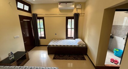 Govardhan Home Stay | 10Min Walk From Airport Room Type - Ac Triple Occupancy Room ( Free One Way Airport Drop )