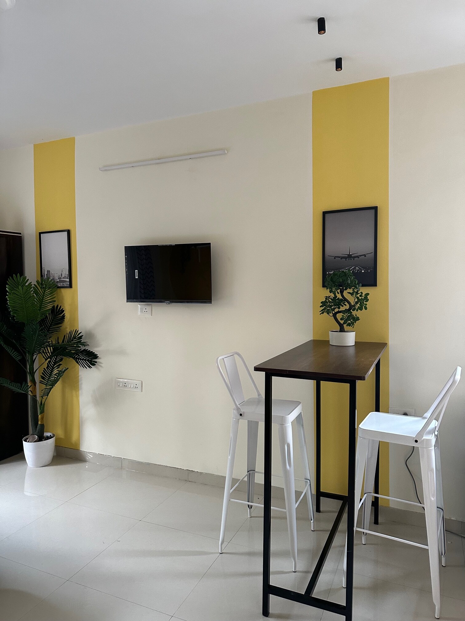 Sunflower Pvt Studio Room in Koregaon Park | AC Wifi Smart TV - Tap to explore photos