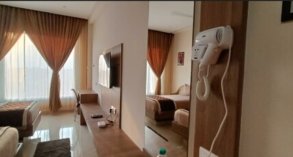 HOTEL VAHINI GRAND Room Type - Business Room Twin Bed AC